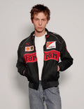 Front view of model wearing a streetwear Black Ferrari Racing Jacket with a relaxed fit
