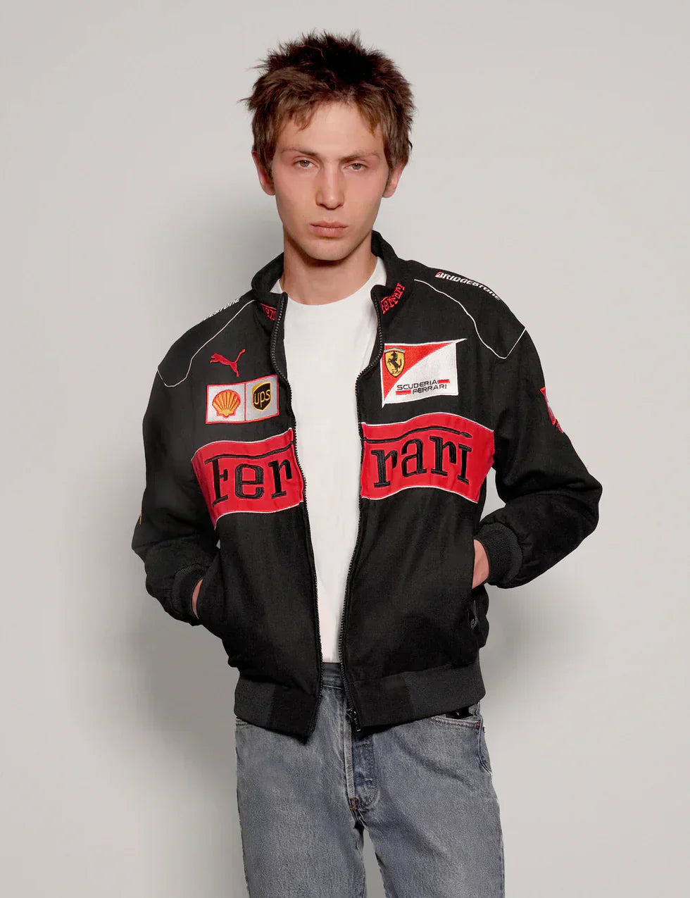 Front view of model wearing a streetwear Black Ferrari Racing Jacket with a relaxed fit
