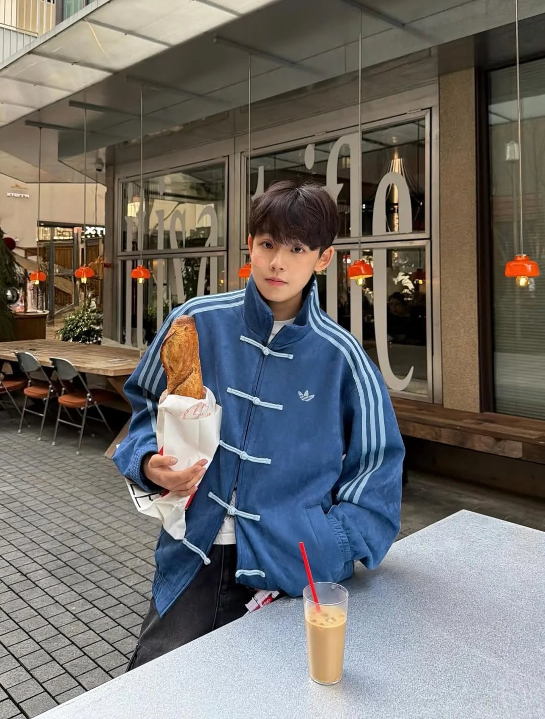Navy Blue CNY Jacket by Northly Streetwear Person in a blue Adidas jacket