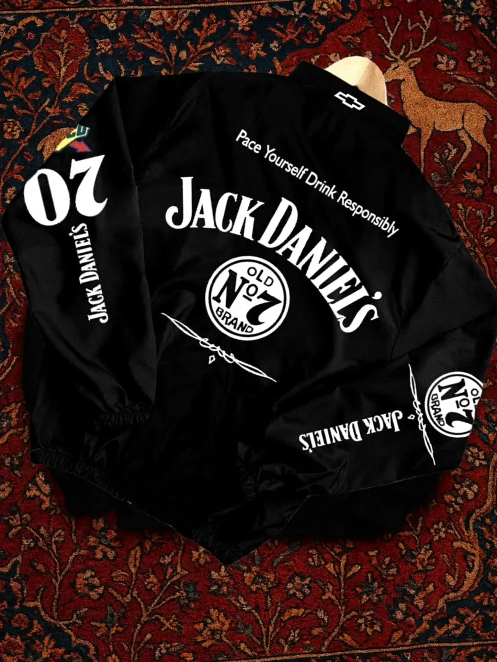 Close up details of windproof parachute fabric and premium prints on the Northly Jack Daniel racing jacket