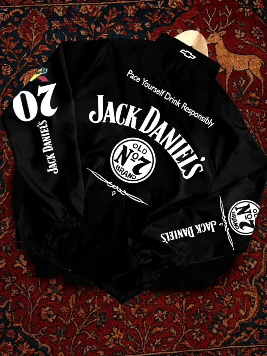 Close up details of windproof parachute fabric and premium prints on the Northly Jack Daniel racing jacket