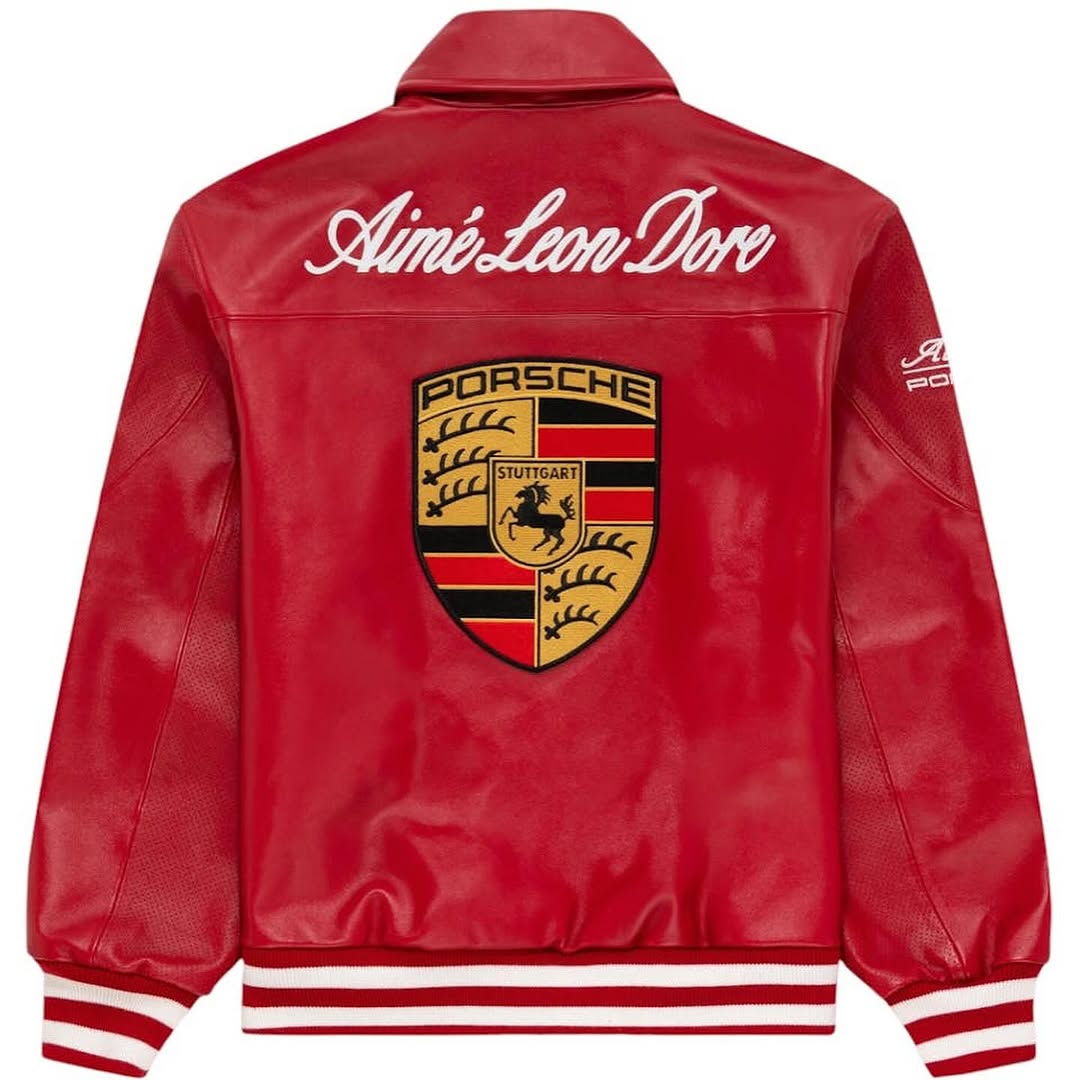 Close-up of racing patches and zip closure on red leather jacket for women