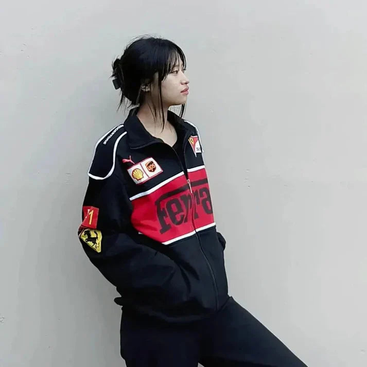 Female model wearing a drop shoulder aesthetic Unisex Black Ferrari Racing Jacket 