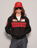 Person wearing a Women Black Ferrari Racing Jacket with red accents on a plain background