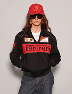 Person wearing a Women Black Ferrari Racing Jacket with red accents on a plain background