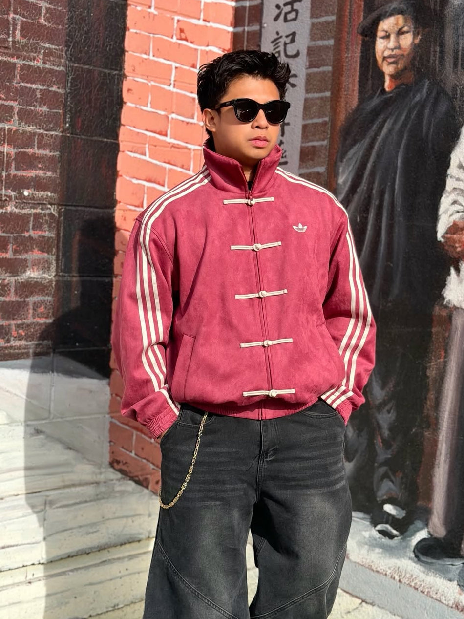 Model styling the trendy y2k crimson red cny streetwear jacket with baggy denim