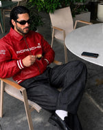 Northly red leather racing jacket sleeve and stitching detail Vintage-inspired red racing jacket with sporty detailing
