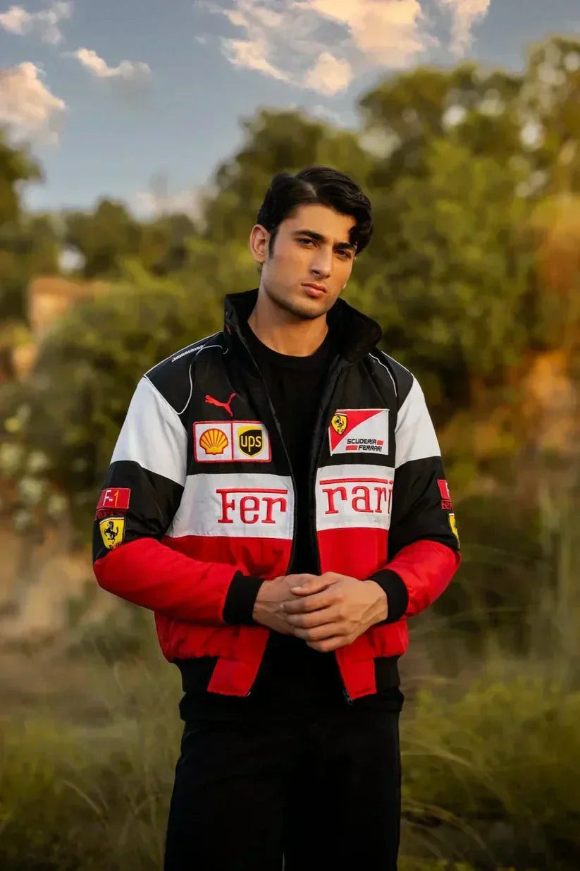 Person wearing a Ferrari jacket with logos in an outdoor setting